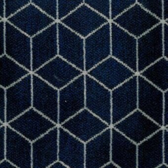 Geometric textile with interlocking dark and light blue hexagons in a woven grid pattern, labeled “Moroso block pattern blue.”